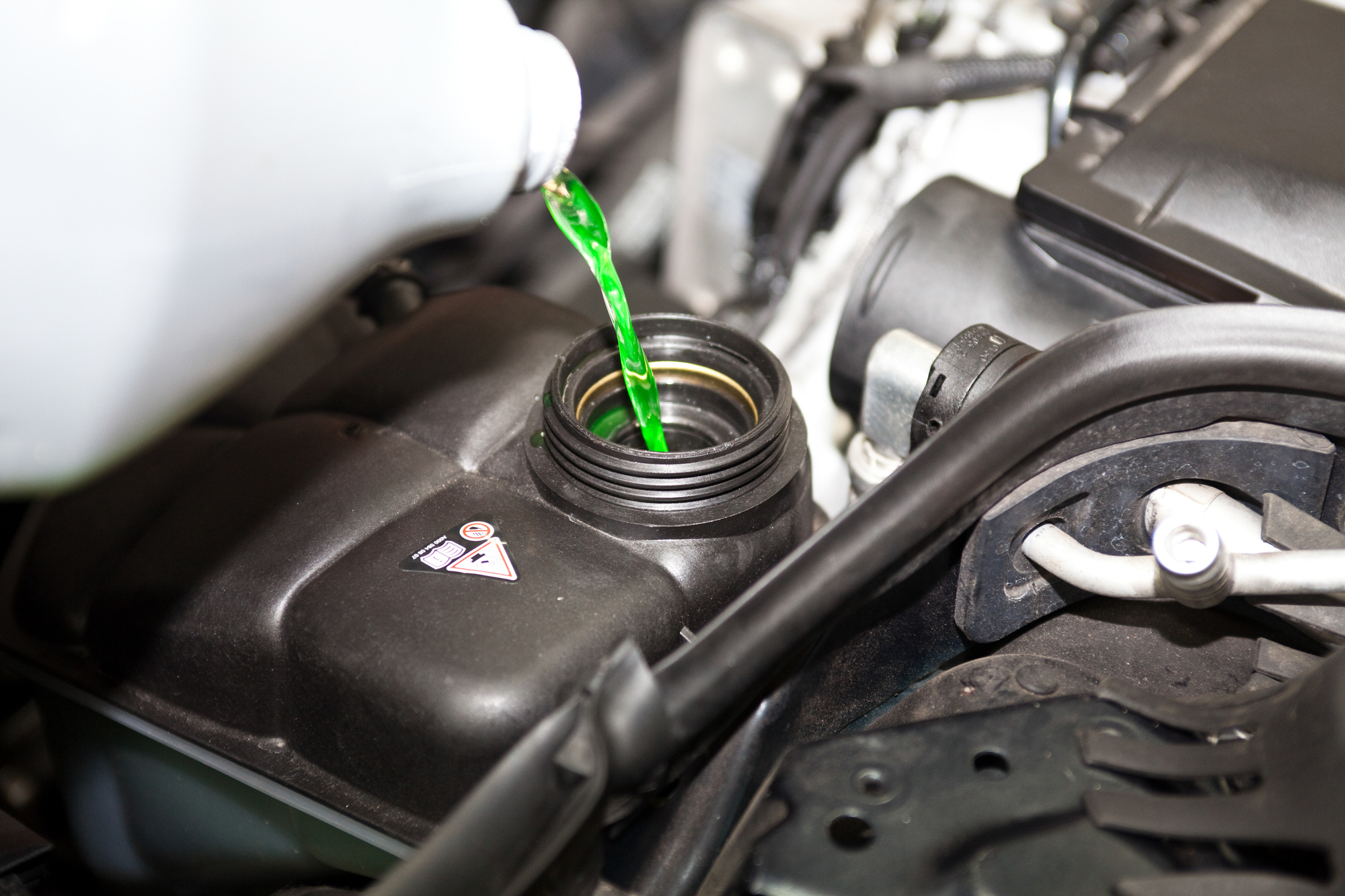 Coolant Being Poured in a Car's Engine