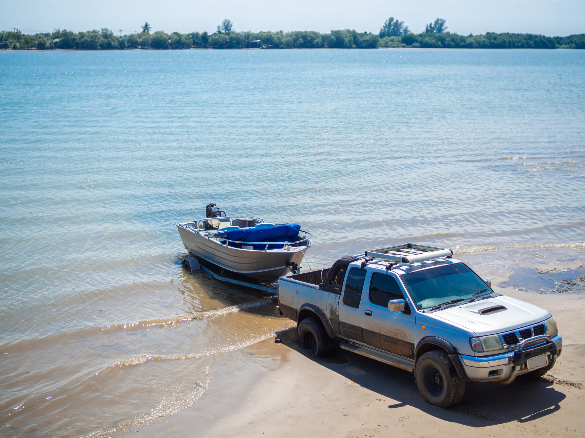 Car Towing a Boat on a Trailer