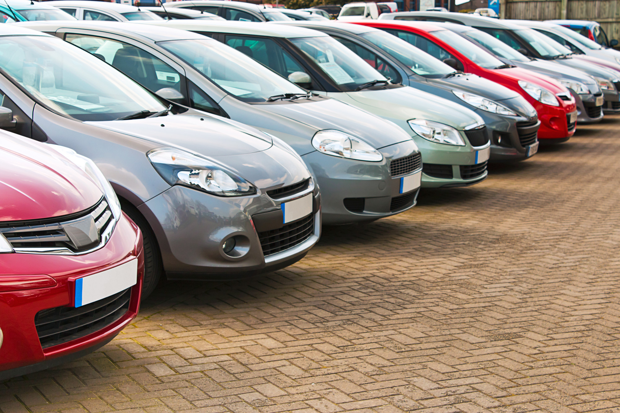 Car Dealership Lot with Cars Lined up