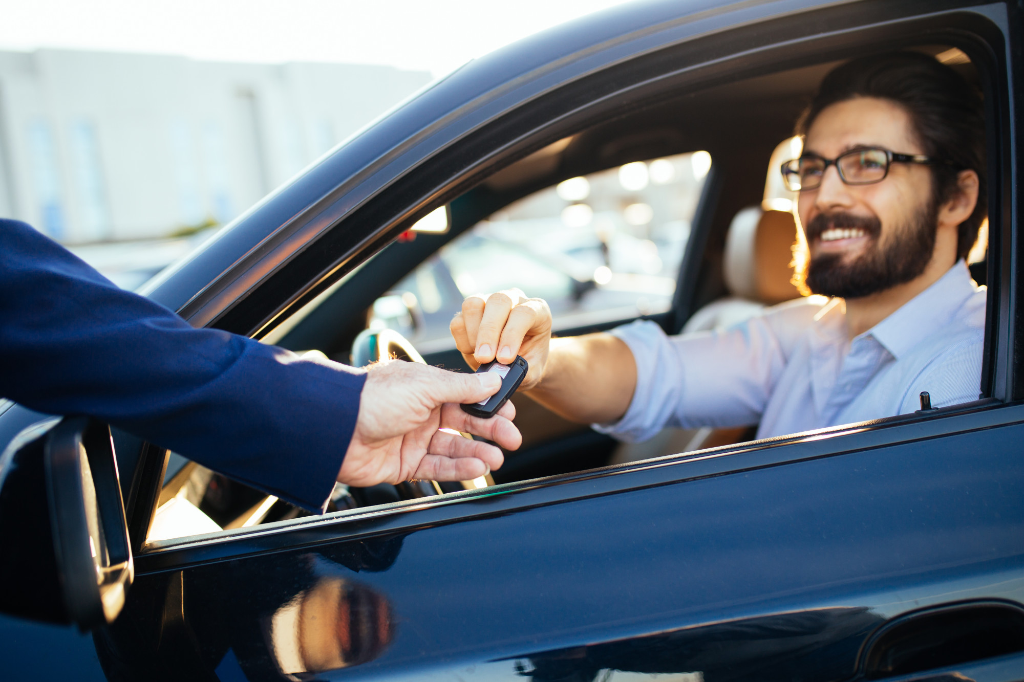 Man Buying a Car at an Auction