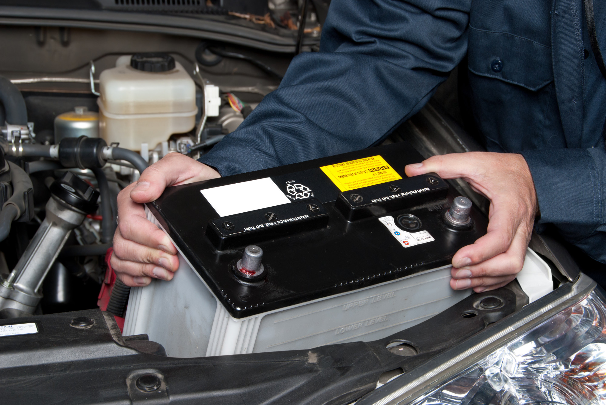 Man Replacing Car Battery